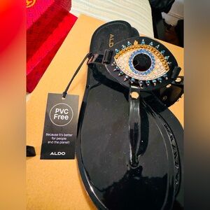 ALDO Black Sandals with Eye Embellishment. Brand new with tags. Never worn